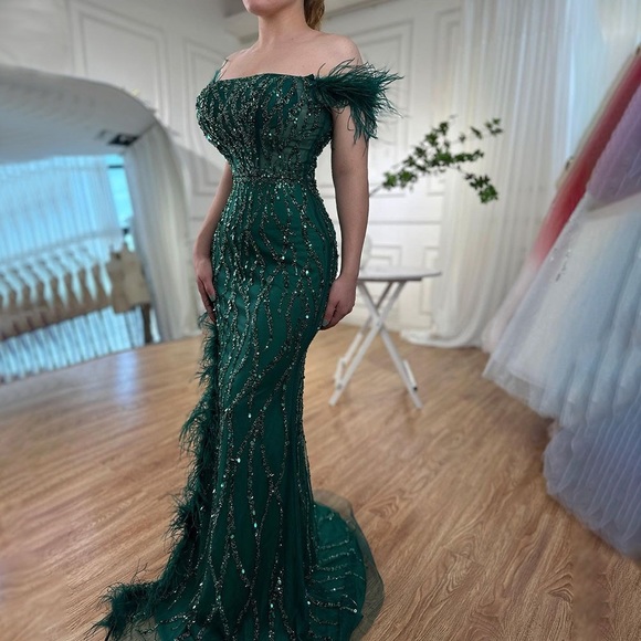 Emerald Off-the-shoulder mermaid dress with feather slit, sequins & short train. - Picture 3 of 5